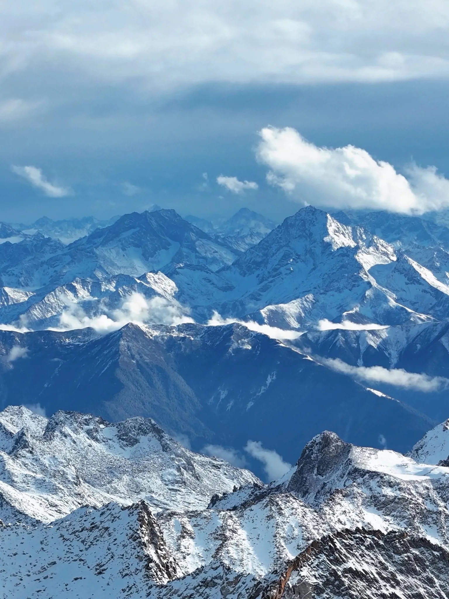 Snow-covered mountain ranges viewed from Dagu Glacier